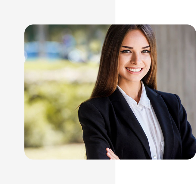 A woman in business attire smiling for the camera.