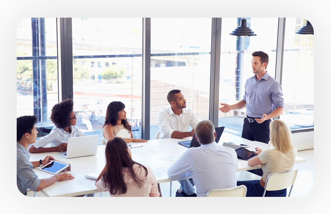 A group of people sitting around a table.